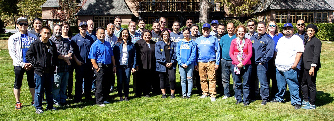 Group of members of the program posing on the lawn.